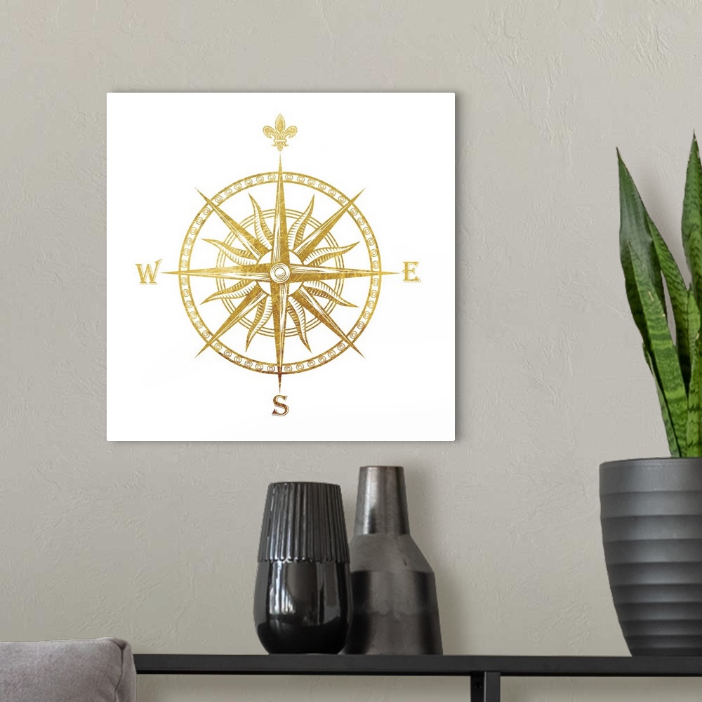 A modern room featuring Gold foil compass with the fleur de lis used for the "N"on a white background.
