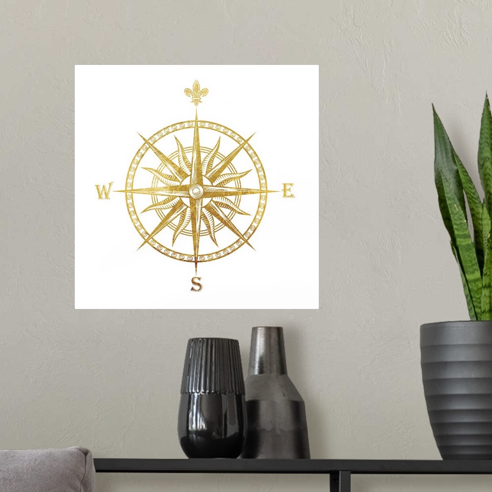 A modern room featuring Gold foil compass with the fleur de lis used for the "N"on a white background.