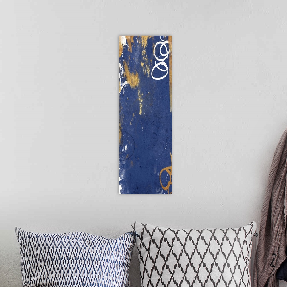 A bohemian room featuring Vertical contemporary abstract art in shades of gold and navy.