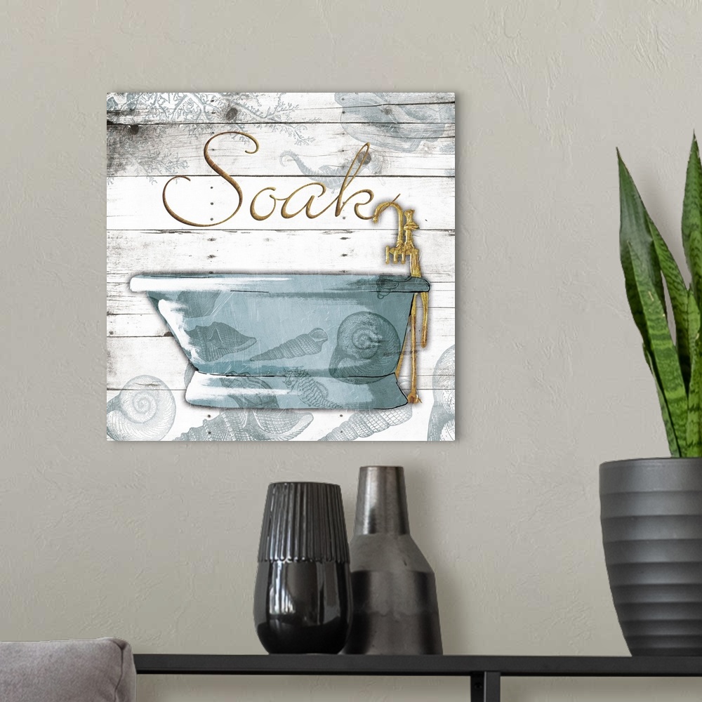 A modern room featuring ?Soak? painted in gold with a blue bath tub on a white wood panel background with a seashell over...