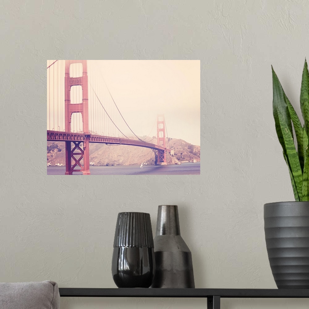 A modern room featuring Artistically filtered photograph of the golden gate bridge shrouded in heavy fog.
