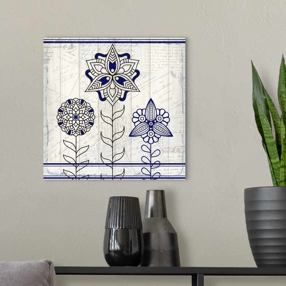 A modern room featuring A black and blue symmetric design of three flowers with a collage of handwritten postcards in the...