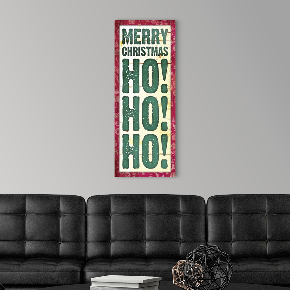 A modern room featuring Vertical Christmas typography art in deep green with a red edge.