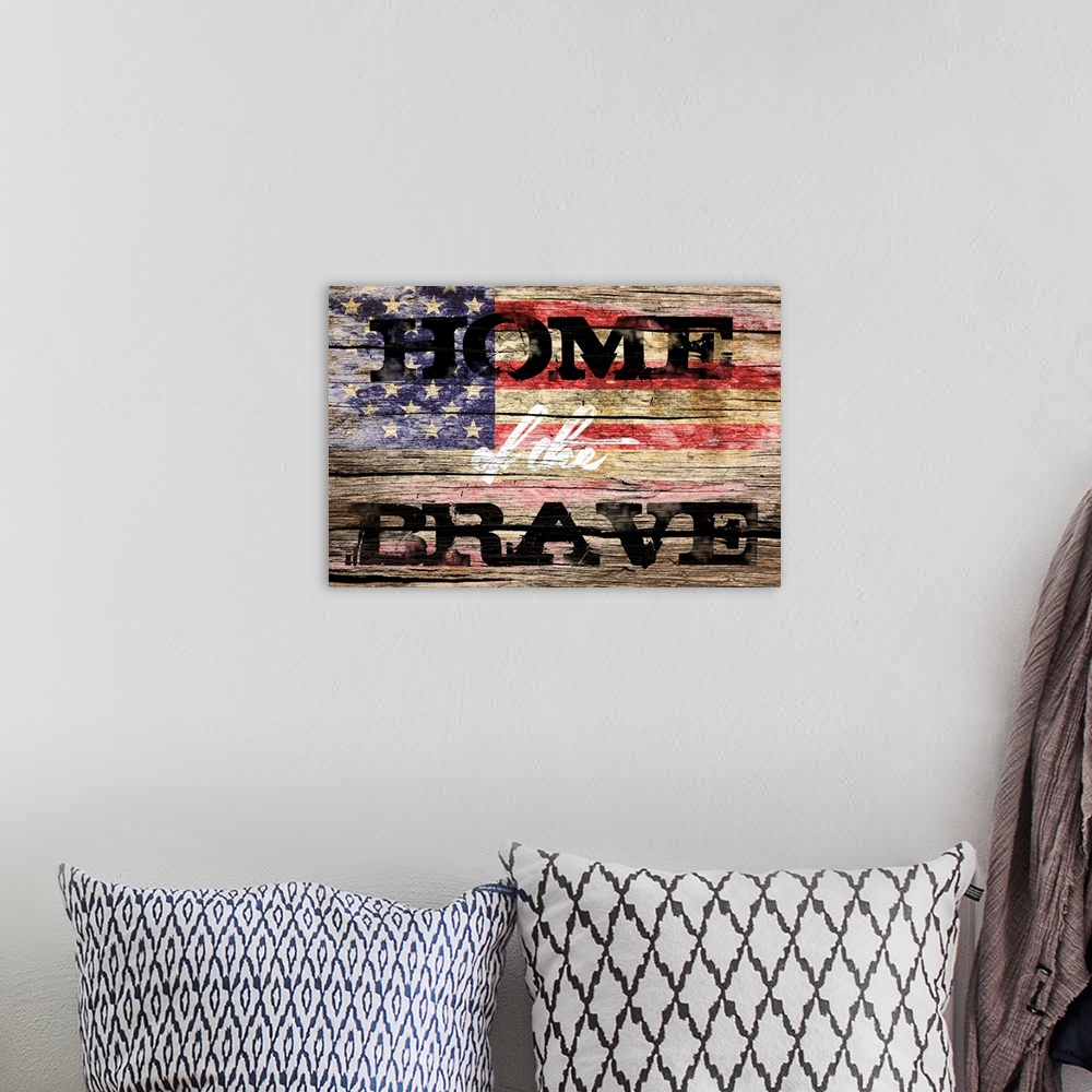 A bohemian room featuring The phrase ?Home of the Brave? placed on a distressed wooden panel background with an American fl...