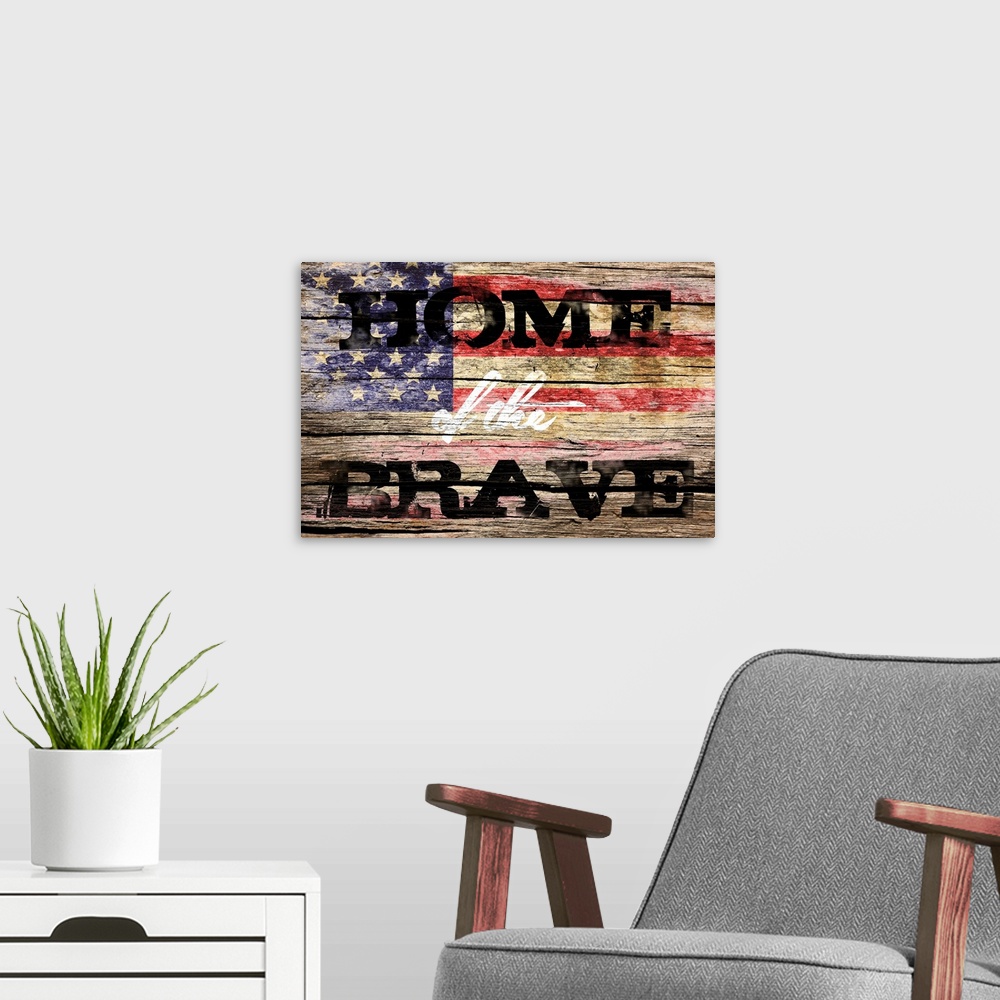 A modern room featuring The phrase ?Home of the Brave? placed on a distressed wooden panel background with an American fl...