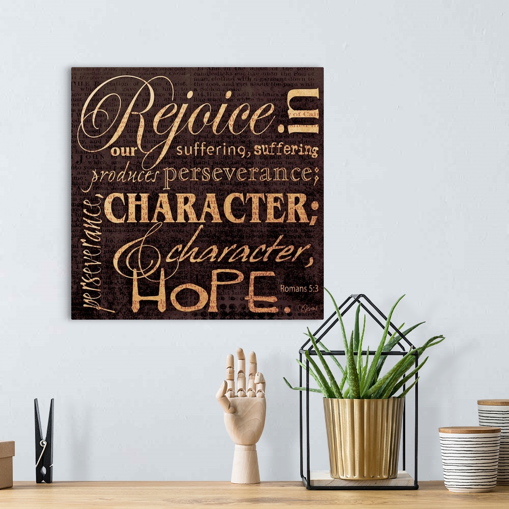 A bohemian room featuring Typographical scripture art done in warm, earthy tones. With text in multiple directions.