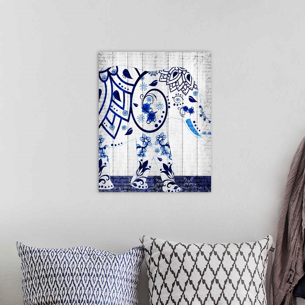 A bohemian room featuring An elephant with a beautiful blue floral design pattern on a white wood panel background with fai...