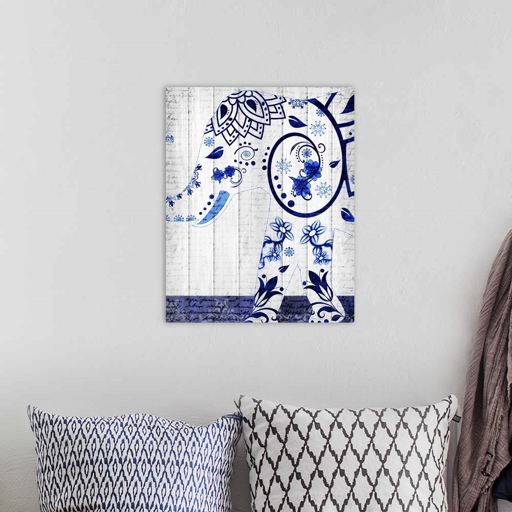 A bohemian room featuring An elephant with a beautiful blue floral design pattern on a white wood panel background with fai...