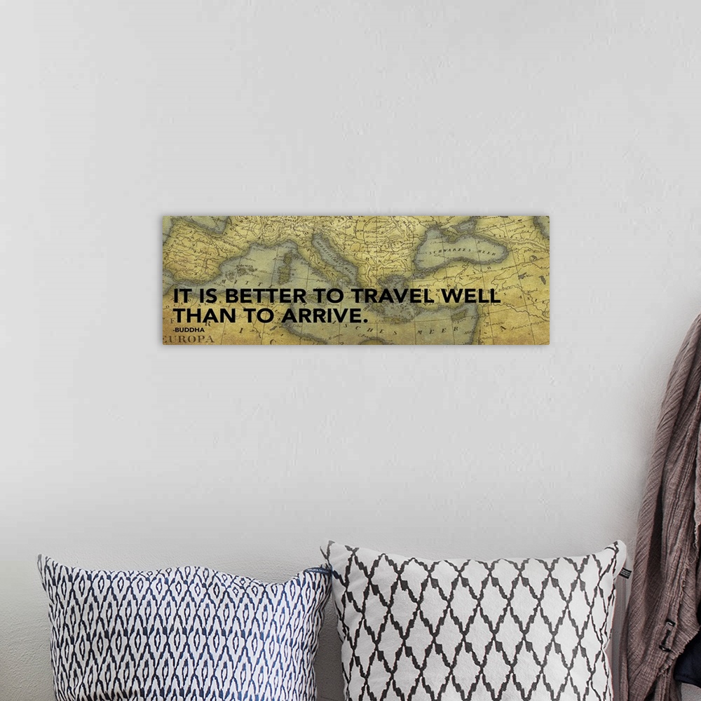 A bohemian room featuring Artwork of inspirational quote with a vintage map of the world in the background.