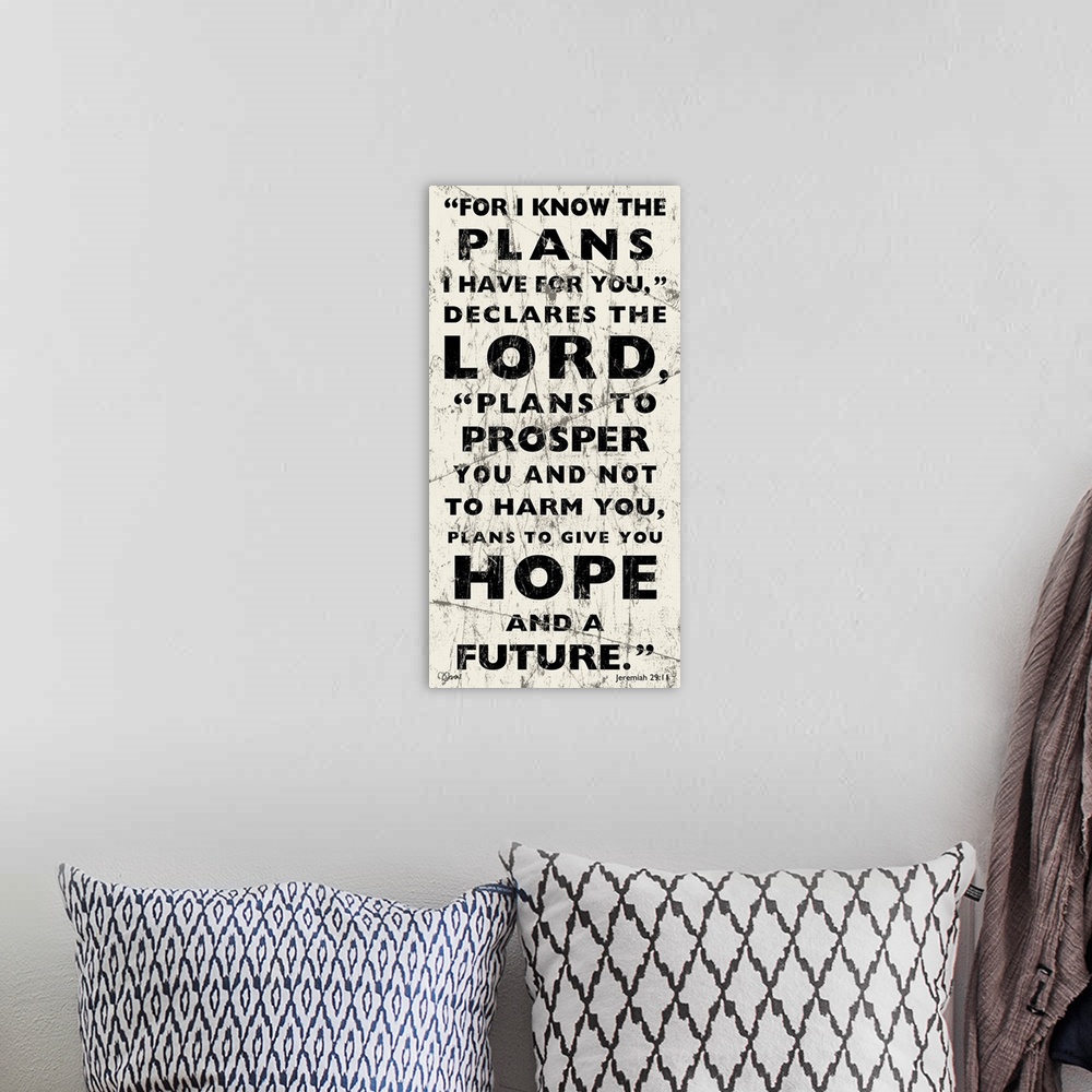 A bohemian room featuring Vertical religious typography art in a weathered, grungy style.