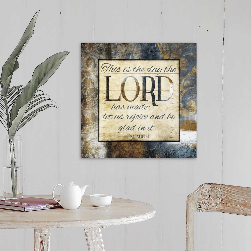 A farmhouse room featuring Typography art of the Bible verse Psalm 118:24 framed with classic style gold and blue flourishes.