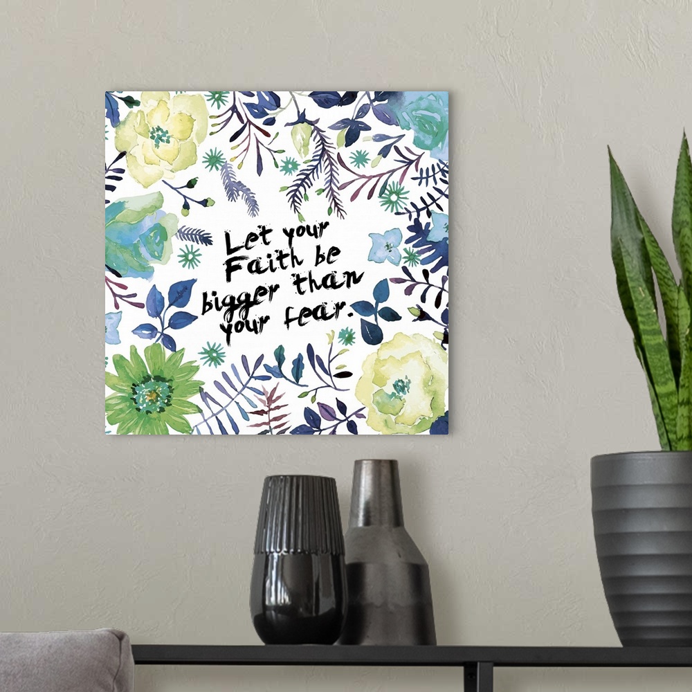 A modern room featuring "Let your faith be bigger than your fear" decorated with watercolor flowers, leaves, and vines.