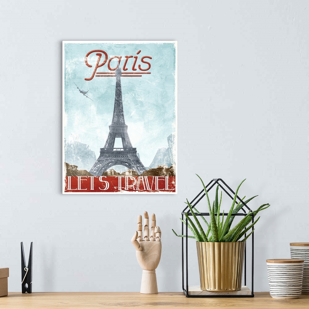 A bohemian room featuring Home decor artwork of a travel poster for France in a vintage style.