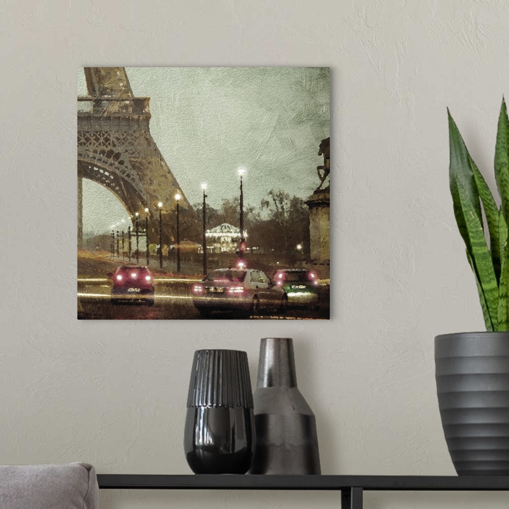 A modern room featuring Traffic in Paris at night at the base of the Eiffel tower.