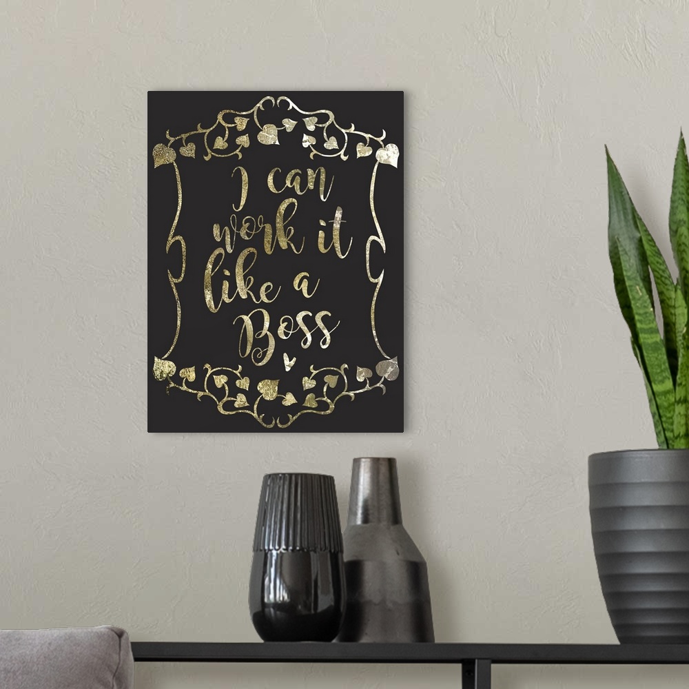 A modern room featuring "I can work it like a boss" written in a gold sparkle font on a black background.
