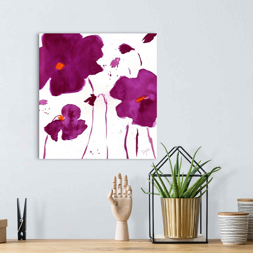 A bohemian room featuring Watercolor painting of dark purple flowers on a white surface.