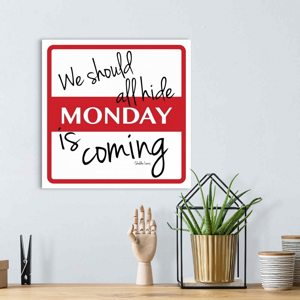 A bohemian room featuring Typographical artwork of a name tag sticker with the word "Monday" in the middle.