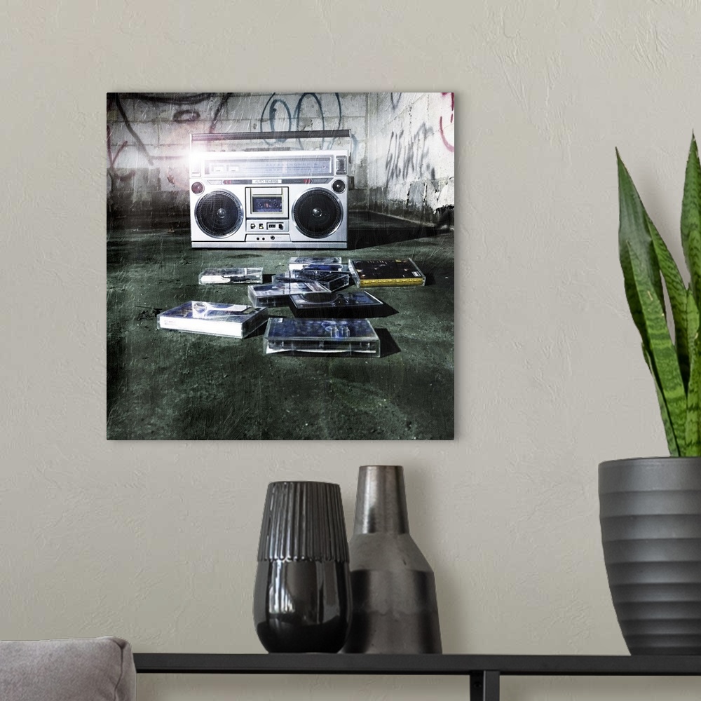 A modern room featuring A classic boom box stereo sitting in an abandoned building with old cassette tapes.