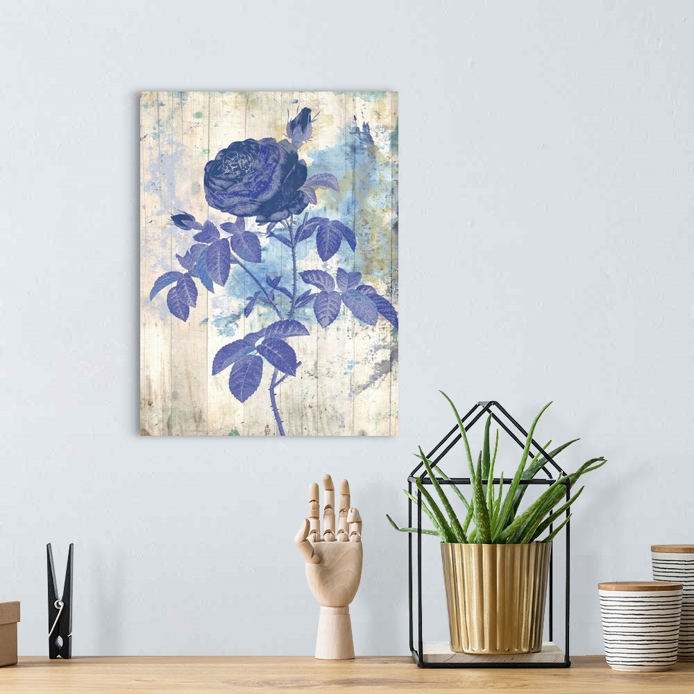 A bohemian room featuring Artwork of a blue flower against a weathered and washed looking background.