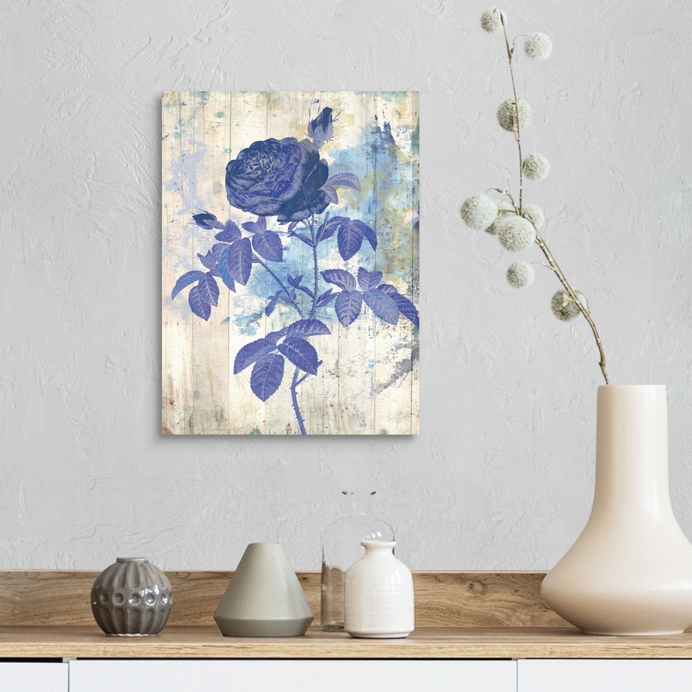 A farmhouse room featuring Artwork of a blue flower against a weathered and washed looking background.