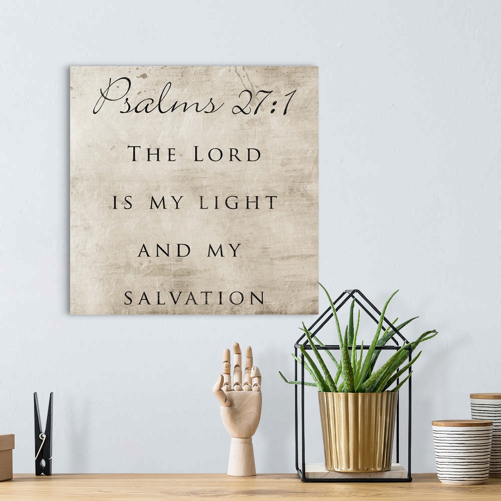 A bohemian room featuring Typography art of the Bible verse Psalms 27:1.