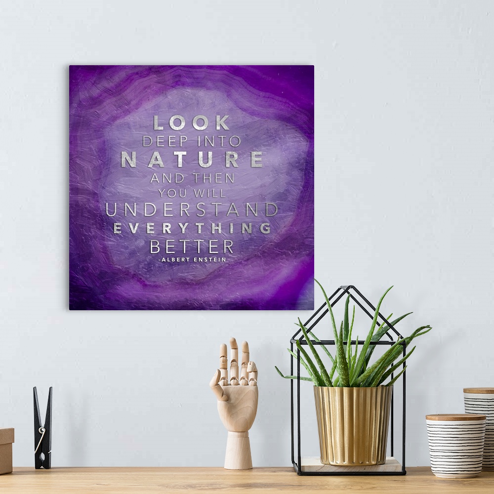 A bohemian room featuring A quotation in silver on a bright purple polished agate stone.