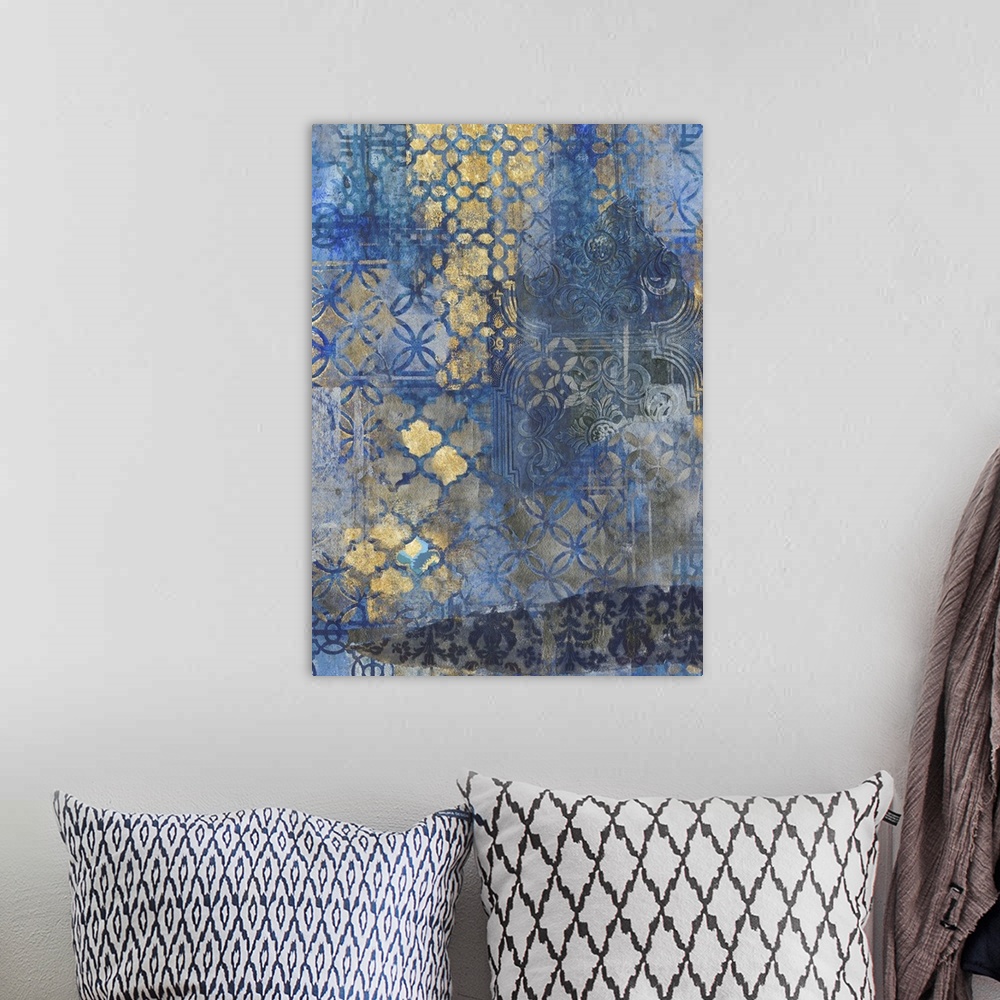 A bohemian room featuring Contemporary pattern home decor artwork of gold ornate patterns against a dark blue background.