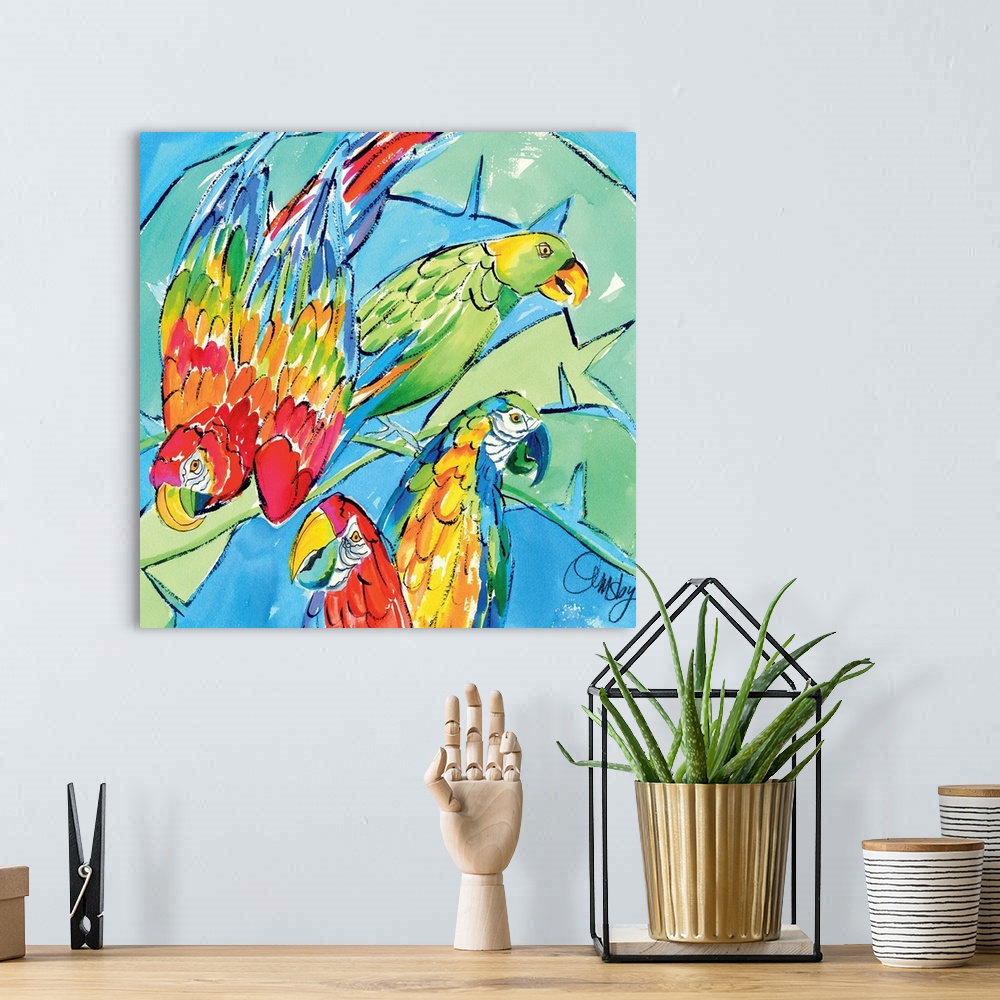 A bohemian room featuring Contemporary artwork of three brightly colored macaw parrots. Surrounded by large lush tropical l...