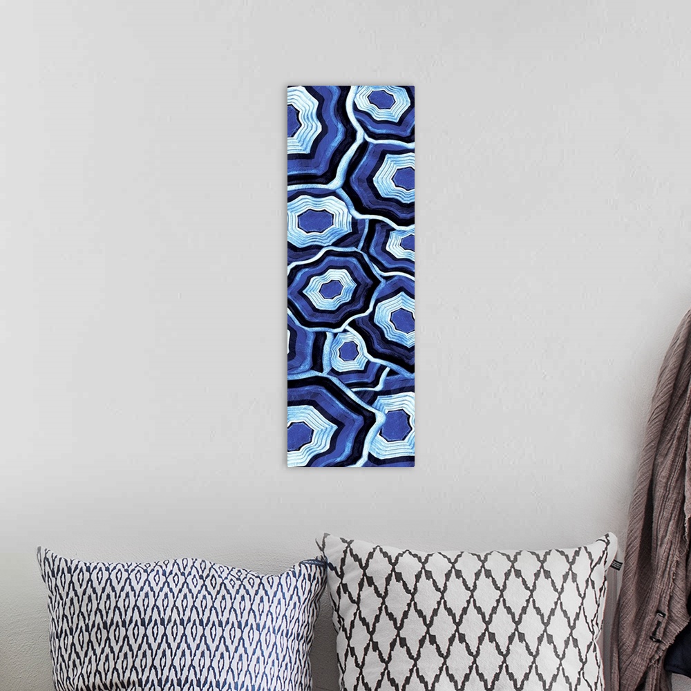 A bohemian room featuring Vertical artwork of an assortment of blue ringed agate stones.