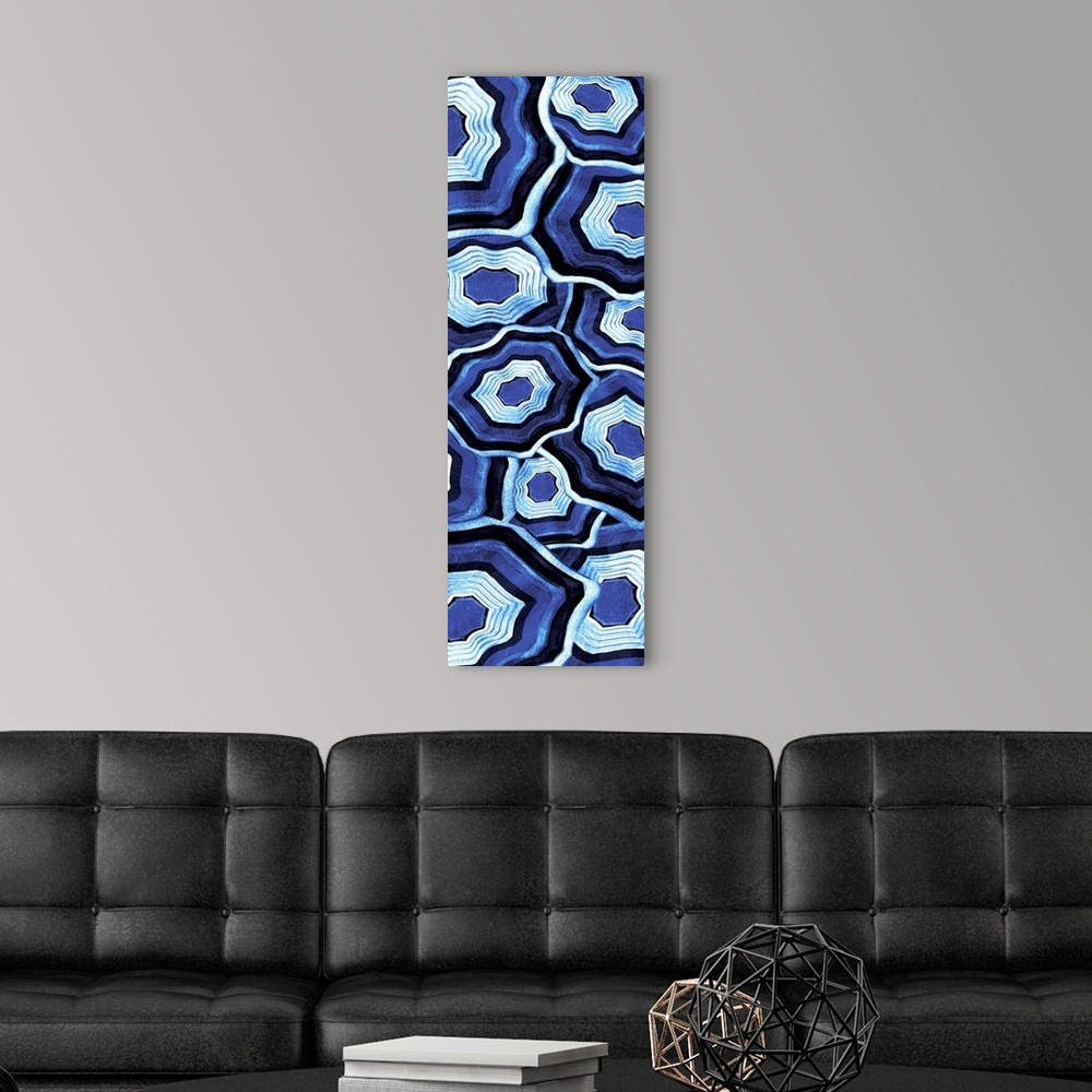 A modern room featuring Vertical artwork of an assortment of blue ringed agate stones.