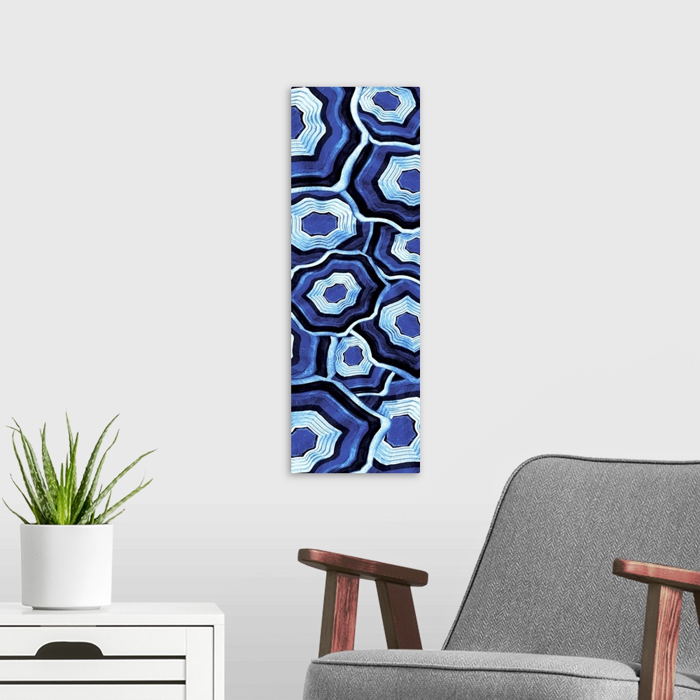 A modern room featuring Vertical artwork of an assortment of blue ringed agate stones.