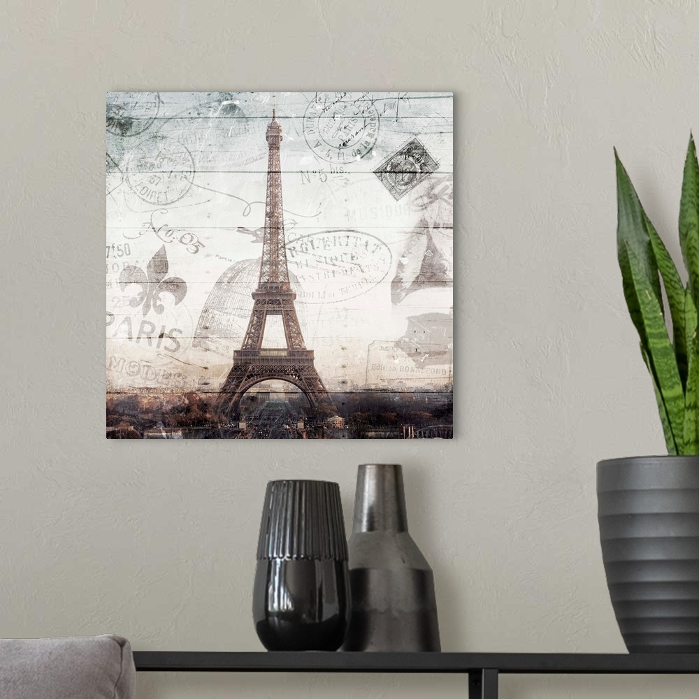 A modern room featuring Square photograph of the Eiffel Tower with a Paris cityscape underneath and a faint wood panel an...
