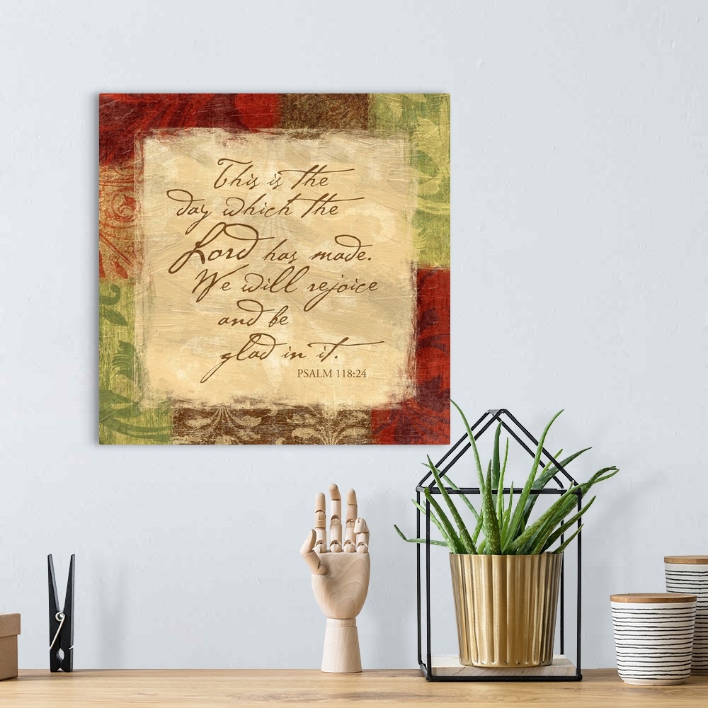 A bohemian room featuring Scripture art with border of floral patterns.