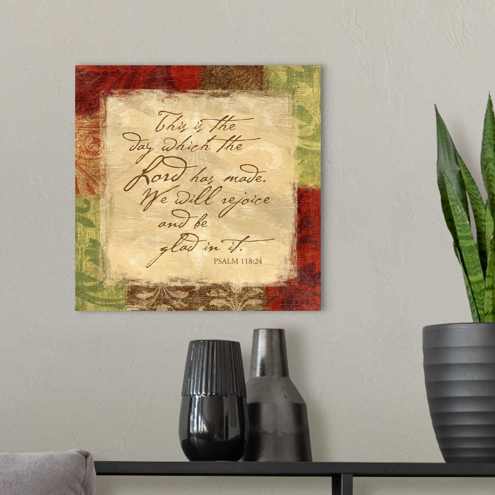 A modern room featuring Scripture art with border of floral patterns.