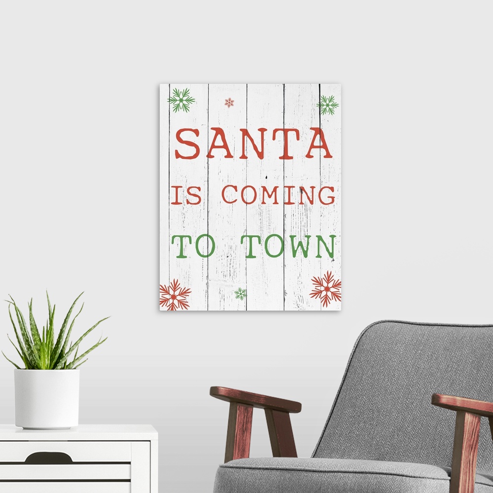 A modern room featuring Simple Christmas typography artwork in green and red on white.