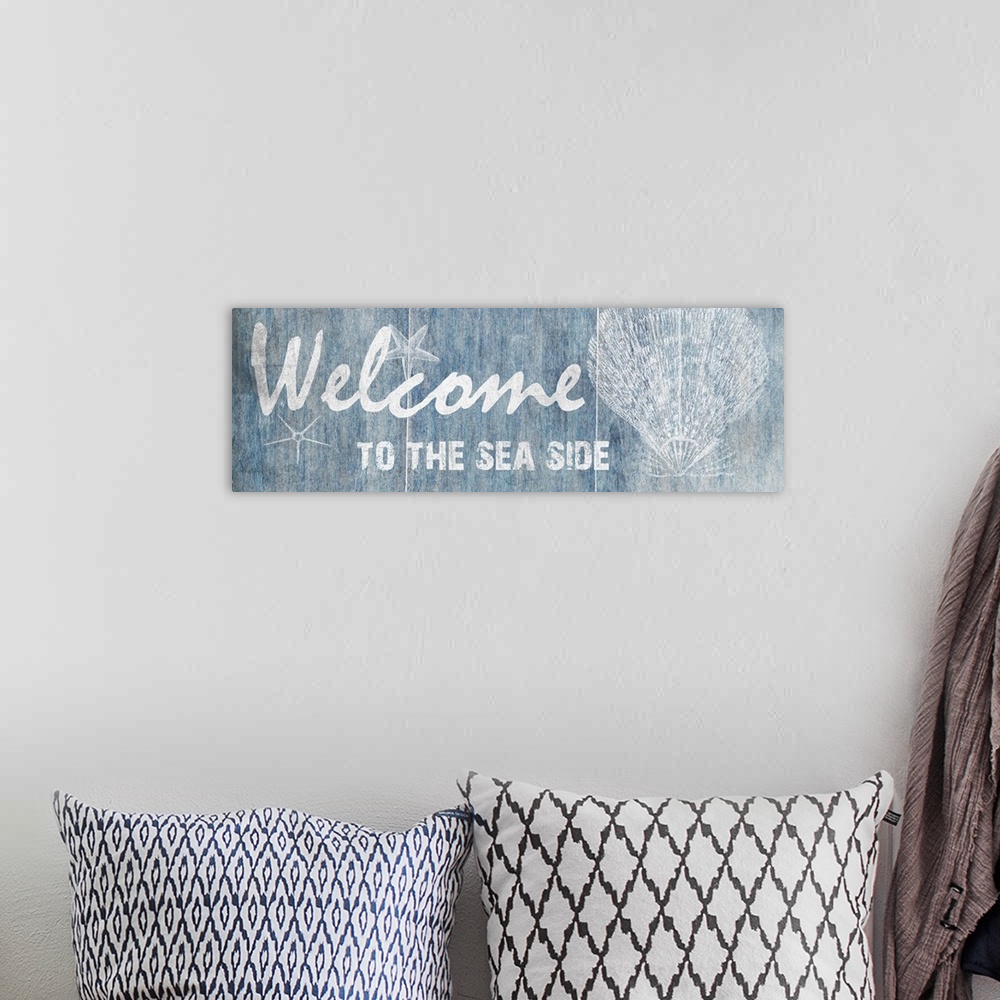 A bohemian room featuring "Welcome to the Sea Side"