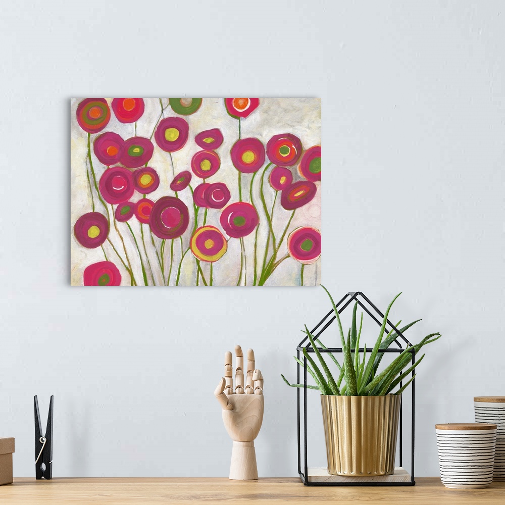 A bohemian room featuring Contemporary abstract painting resembling red flowers.