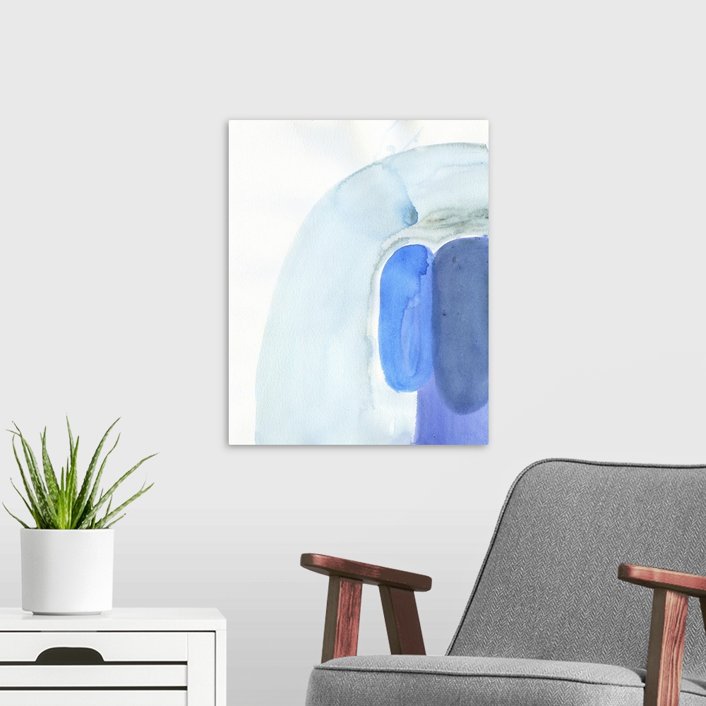 A modern room featuring Watercolor abstract artwork in shades of blue.