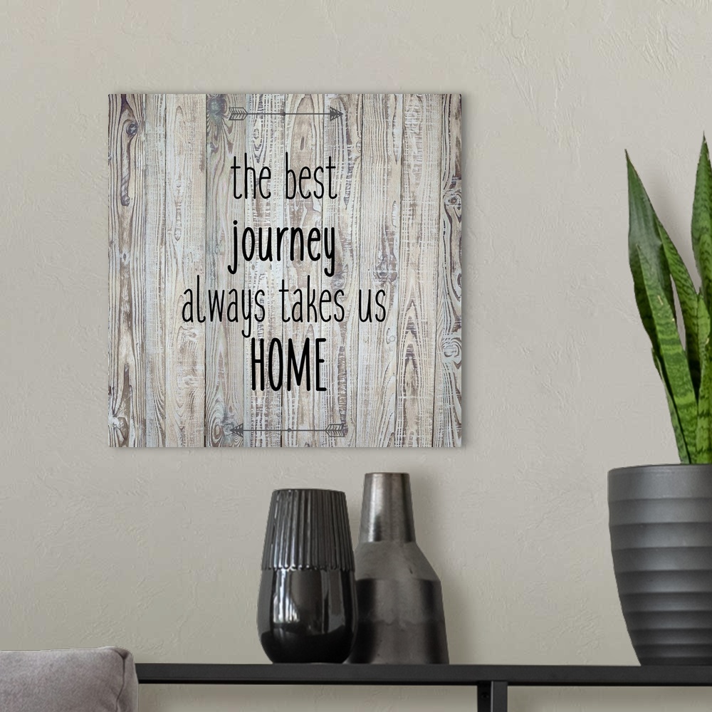 A modern room featuring The Best Journey Always Takes Us Home