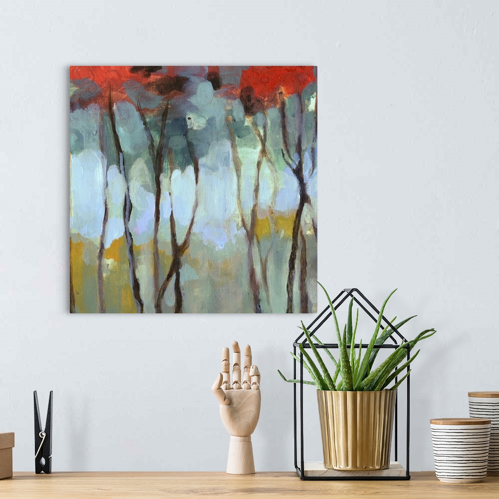A bohemian room featuring Contemporary artwork of thin birch trees in a dark forest with bright leaves.
