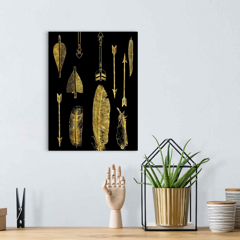 A bohemian room featuring An assortment of feathers and arrows in gold on black.