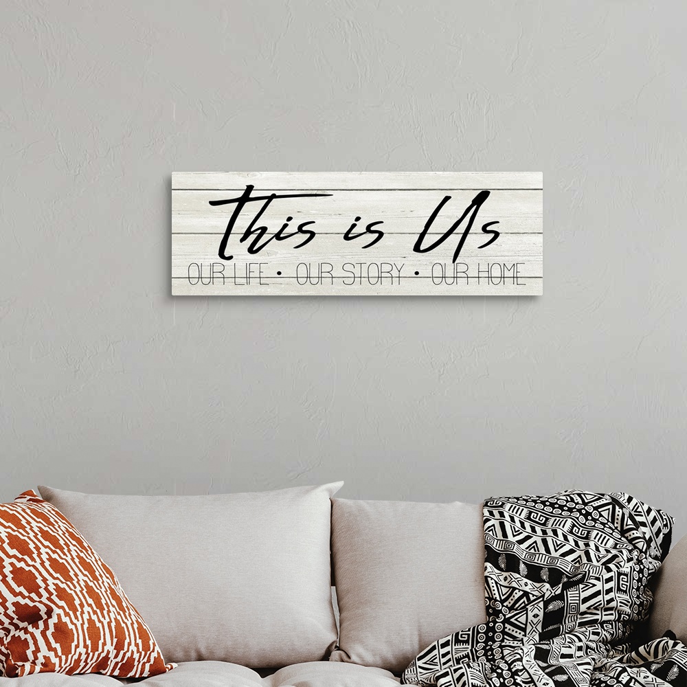 A bohemian room featuring "This is Us, Our Life, Our Story, Our Home" on a white wood plank background.