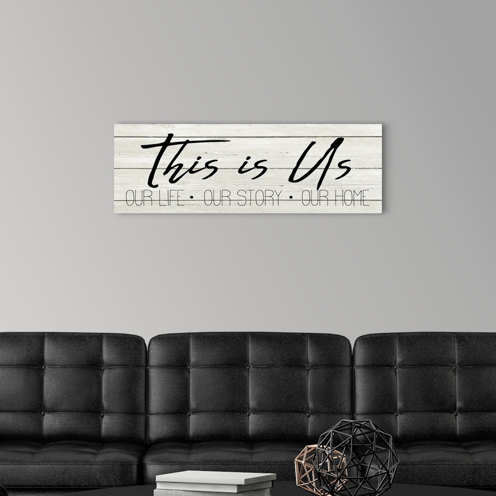 A modern room featuring "This is Us, Our Life, Our Story, Our Home" on a white wood plank background.
