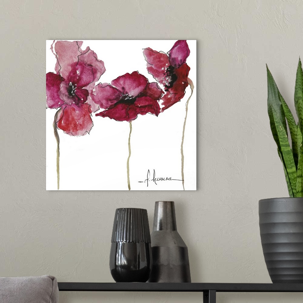 A modern room featuring Watercolor painting of three red poppy flowers with long stems.