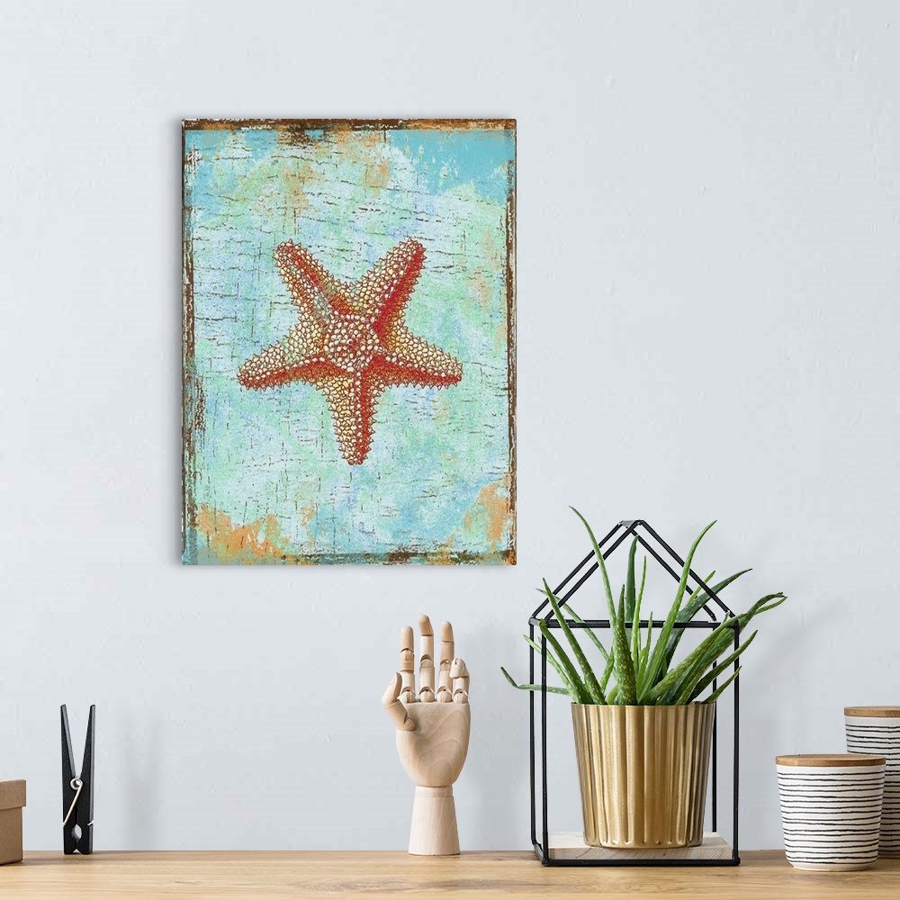 A bohemian room featuring Artwork of a red starfish against a weathered turquoise background