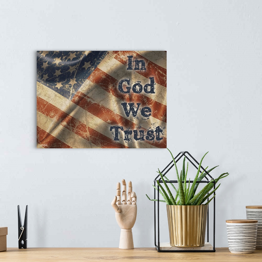 A bohemian room featuring "In God We Trust" on a rustic waiving American flag.