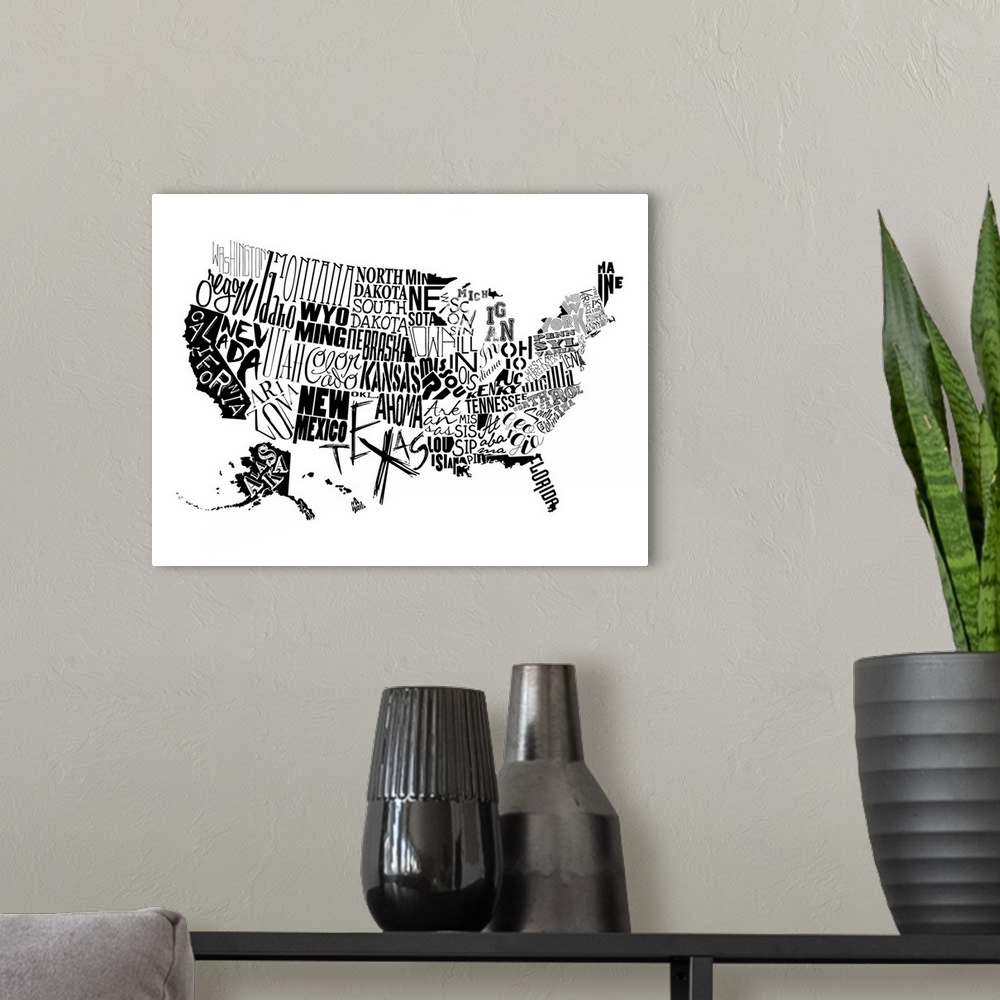A modern room featuring A contemporary typography map of the United States with all the state names in black and white.