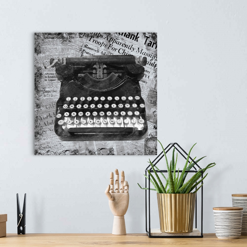 A bohemian room featuring A black and white image of a vintage typewriter on a newspaper clipping background.