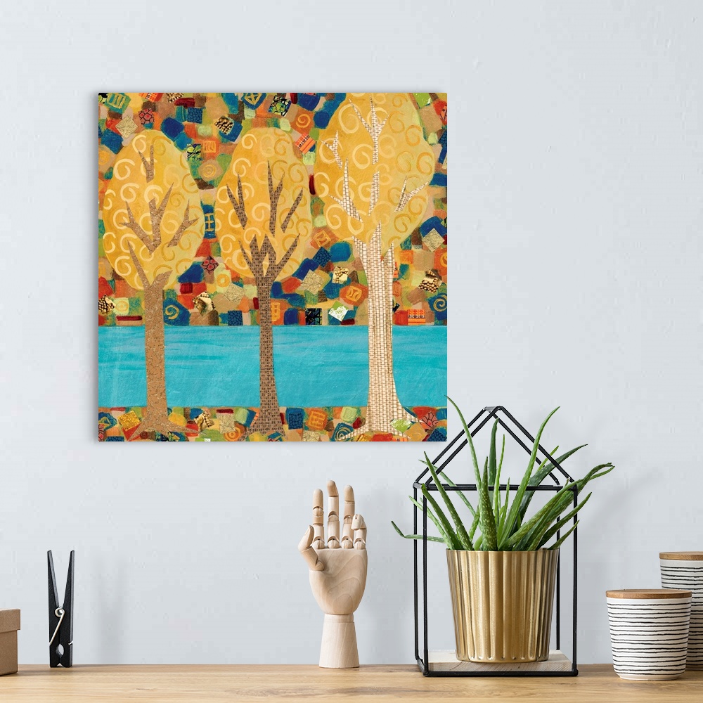 A bohemian room featuring A painting of three trees of different sizes, with what looks like a stream in the background.