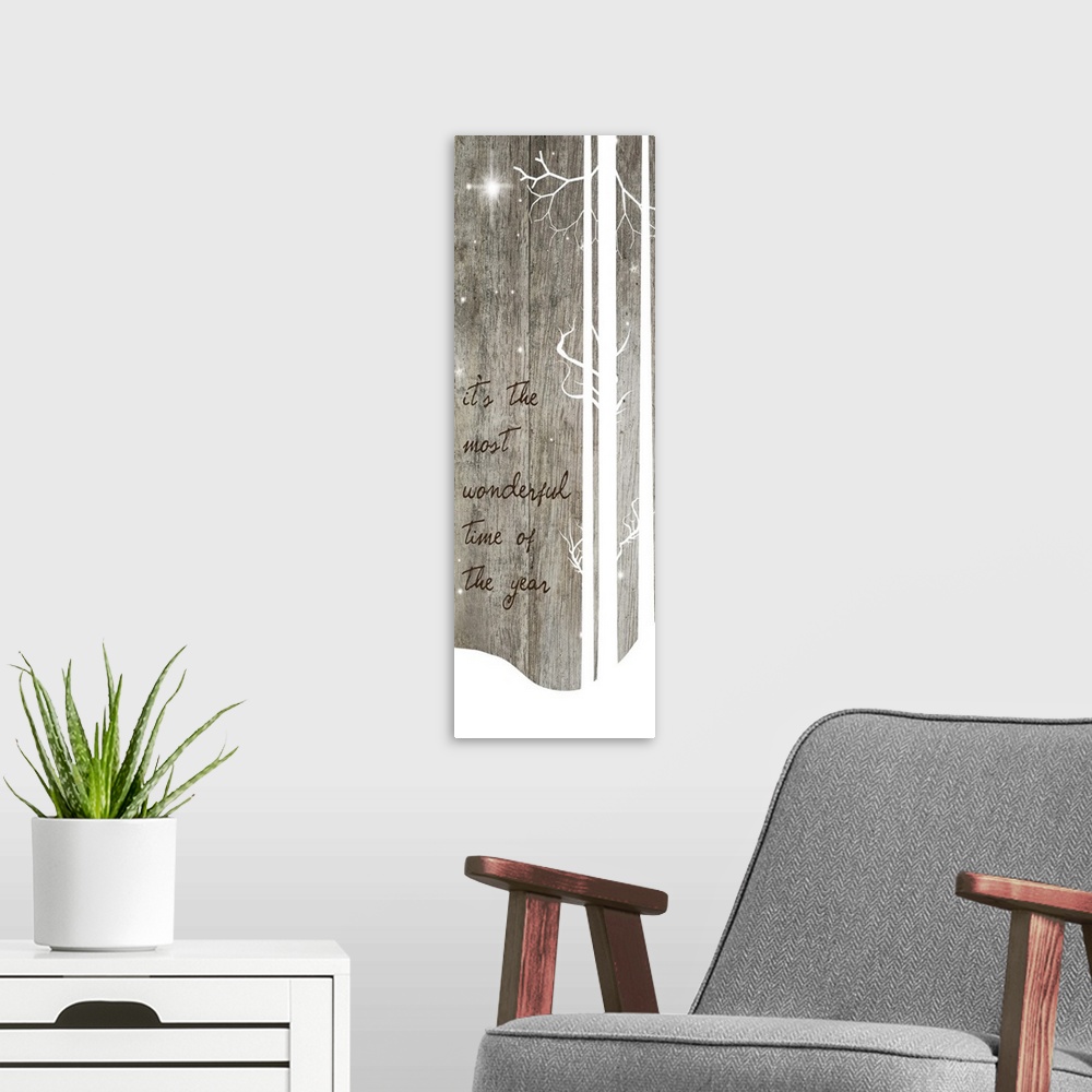 A modern room featuring Holiday themed artwork of white silhouetted trees with a carol lyric.